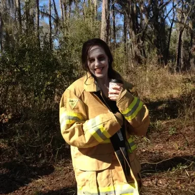 Acting 5 Actress Shannon Scott in a fireman's jacket warming up after being in the water shooting a film.