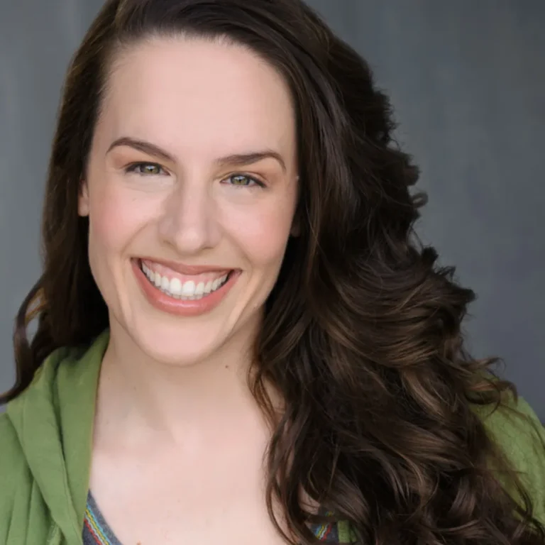 Smiling professional voice actor headshot for contact and booking inquiries