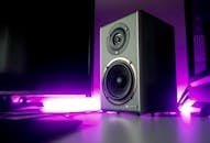 Voiceover 5 High-quality speaker setup with vibrant purple lighting in a modern studio setting.