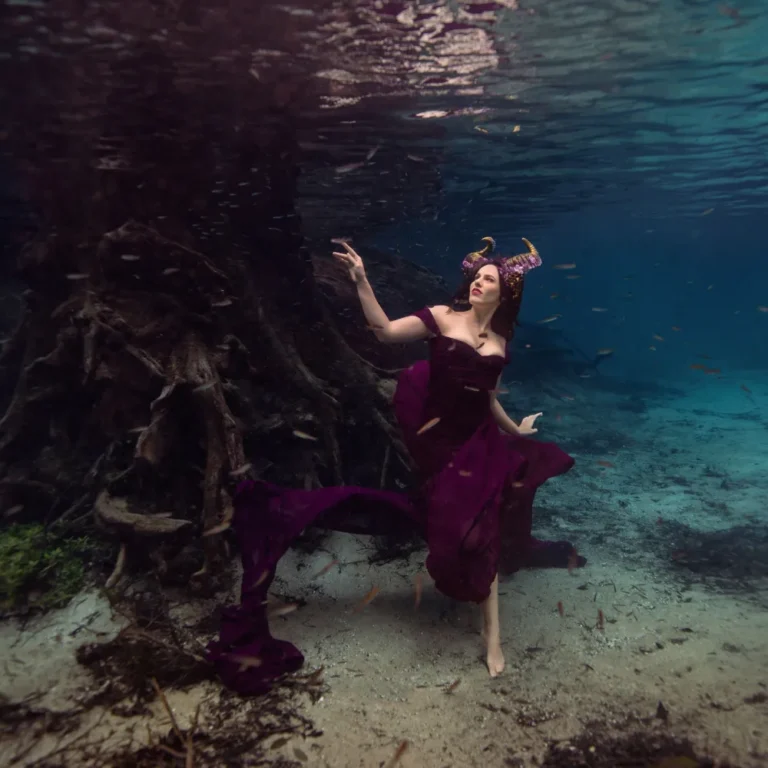 Freediving model Shannon Scott gliding underwater with strong breath-hold control and graceful movement, showcasing athleticism and artistry.