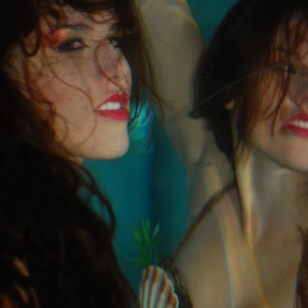 How to Overcome Imposter Syndrome as a Creative: 5 Powerful Exercises for Actors & Artists 2 Underwater portrait of Shannon Scott immersed in water, symbolizing self-doubt in artists.