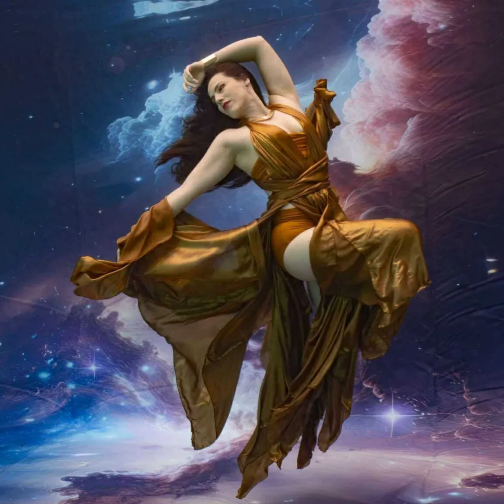 Beyond the Algorithm: Why Replacing Real Performers with AI Will Cost You More Than Money 4 Underwater fashion model Shannon Scott floating gracefully in a flowing outfit, capturing elegance and movement beneath the surface.