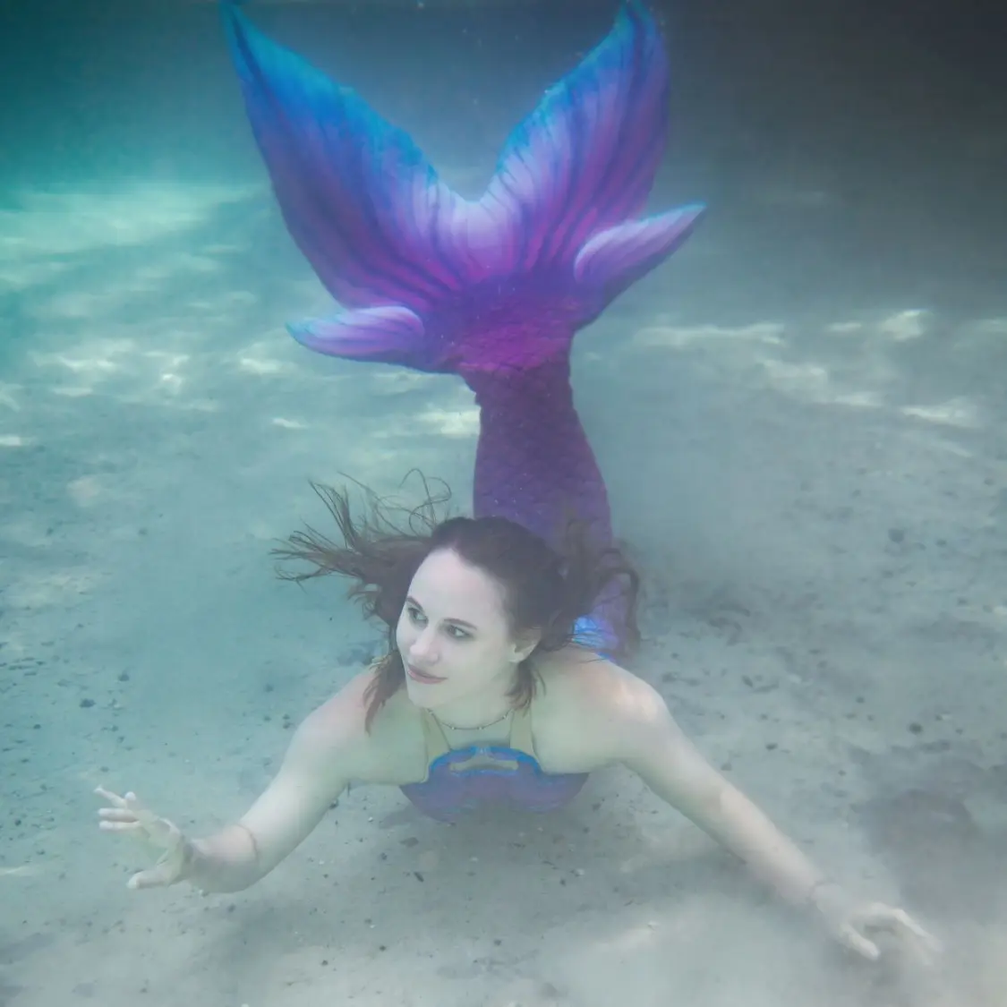 5 Powerful Ways to Shine as a Creative Misfit (Even When You Feel Left Out) 5 An ethereal underwater photo of a mermaid gracefully floating, symbolizing artistic freedom, confidence, and self-expression.