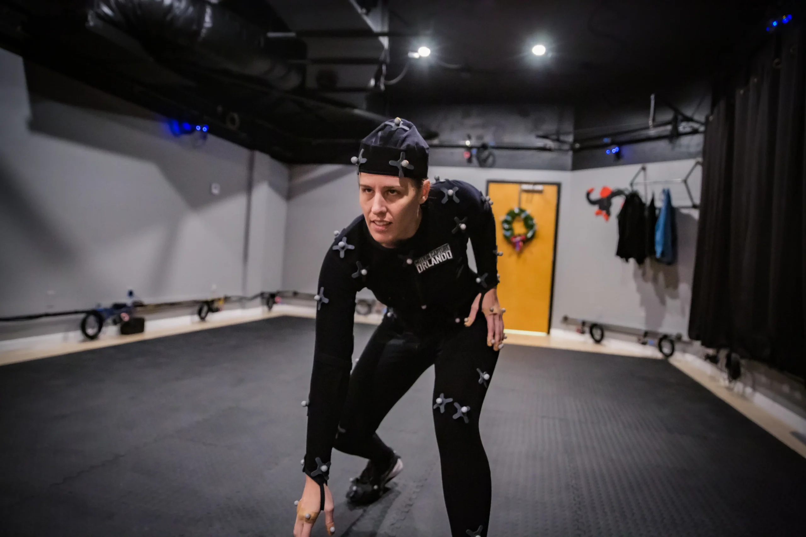 Performance Capture Acting: 7 Powerful Ways Actors Bring Digital Characters to Life 1 Shannon Scott in a performance capture volume, inviting clients to request an audition for motion capture, acting, and voiceover roles.
