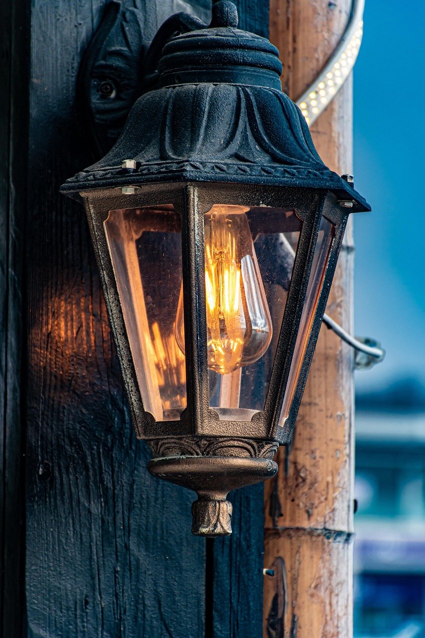 Vintage street light glowing at dusk, symbolizing embracing your voice and letting it shine
