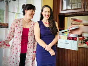 Portrait of Shannon Scott on set with a friend, featured on her demo and portfolio page showcasing acting and voiceover work.