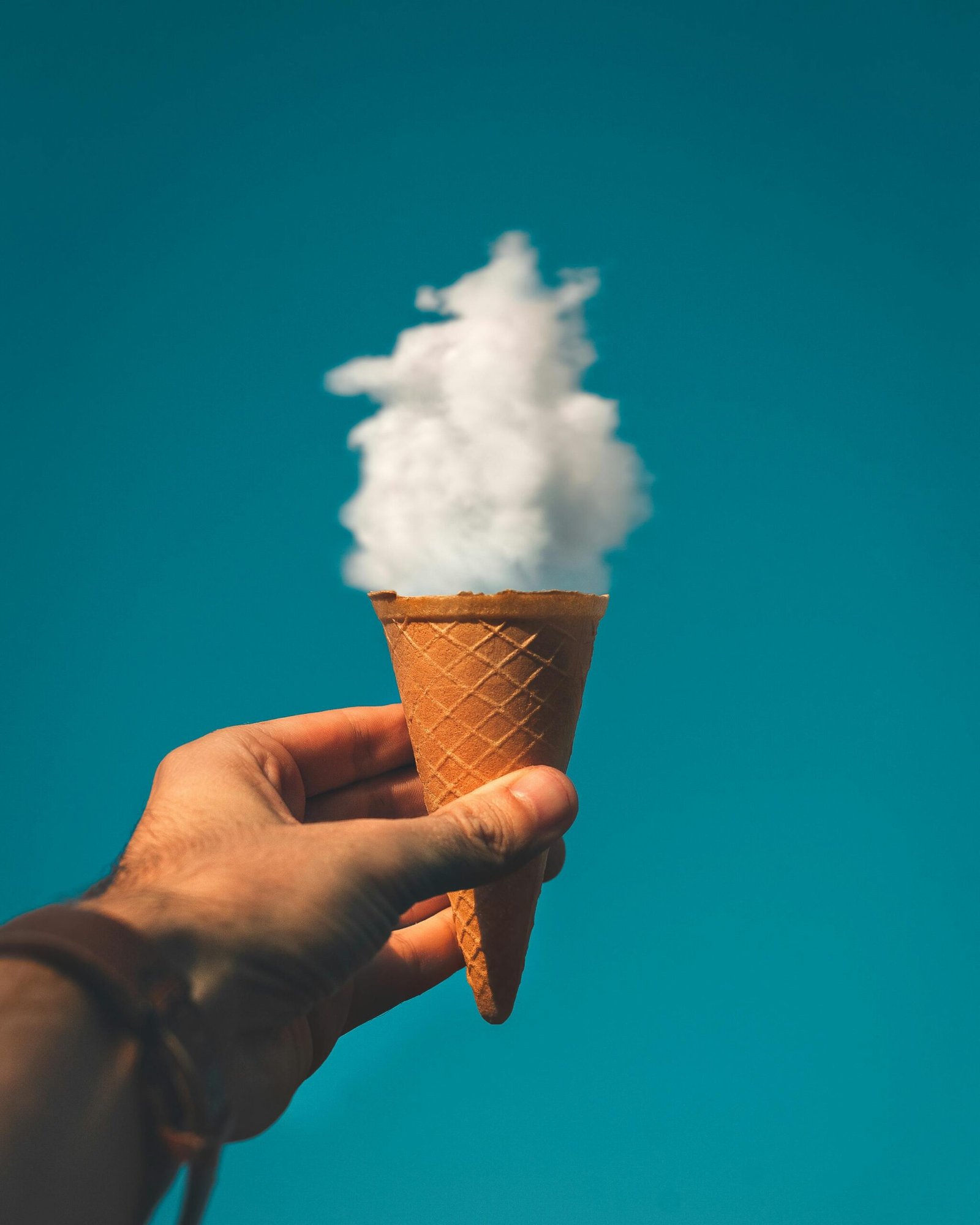 The Healing Power of Play: Lessons from Acting & Mermaiding 2 A whimsical ice cream cone topped with fluffy clouds, symbolizing imagination and creative expression and play.