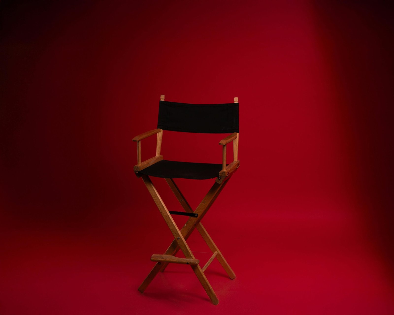 The Pay‑to‑Play Hustle: What It Really Costs to Be a Working Actor 3 A director’s chair symbolizing the high cost of audition submission fees for actors pursuing roles.