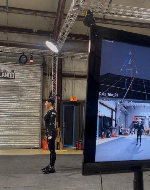 Motion Capture Lessons Learned From a Performer in the Volume 2 Shannon Scott performing in a motion capture volume studio, wearing a full mo-cap suit with sensors, bringing a digital character to life.