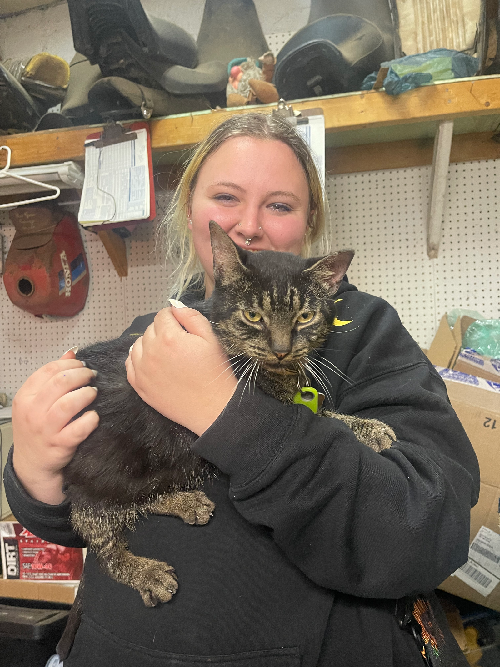 Destiny, script supervisor on Eddie’s Trailer Park, holding a cat on location. indie film behind the scenes.