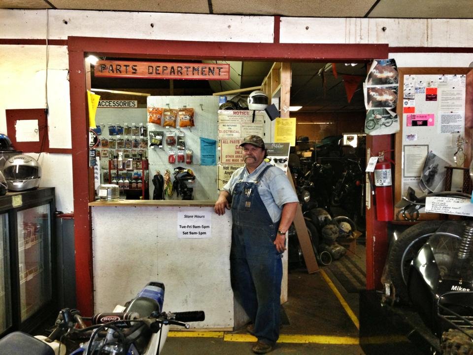 Mike standing at Mike’s Cycle & Marine, filming location for Eddie’s Trailer Park