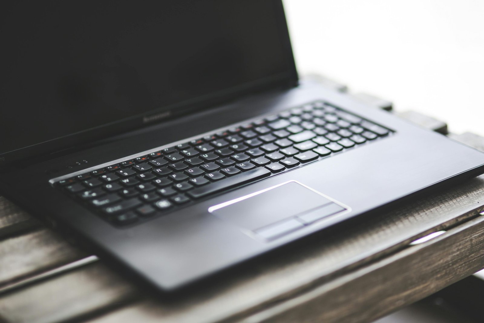 How Creatives Can Manage Business with Confidence and Keep Their Spark 3 Laptop on desk representing how to run a voice over business and voice actor business tips workflow planning