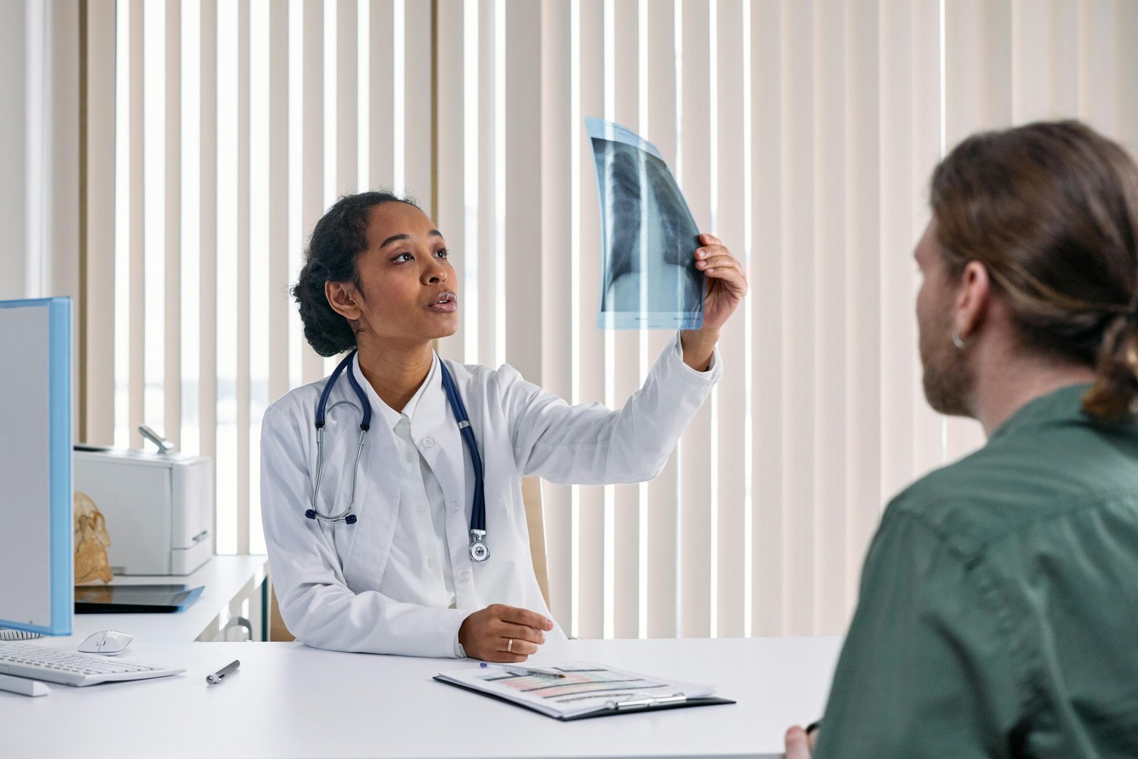 Healthcare professional explaining medical information to patient for improved understanding and communication