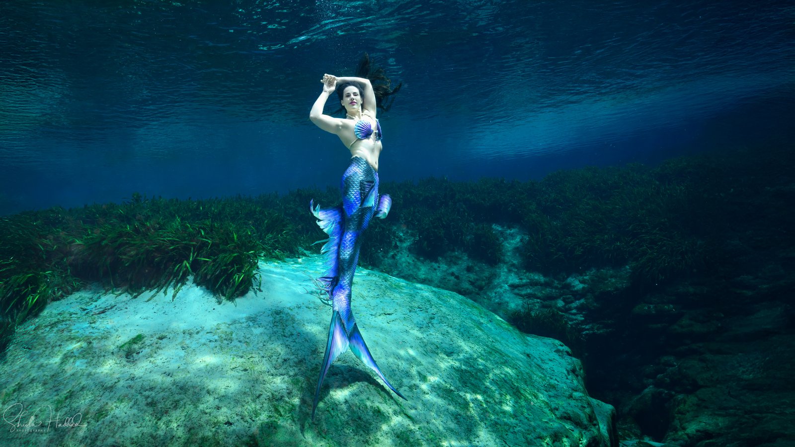 Shannon Scott embracing the healing power of play as an underwater mermaid