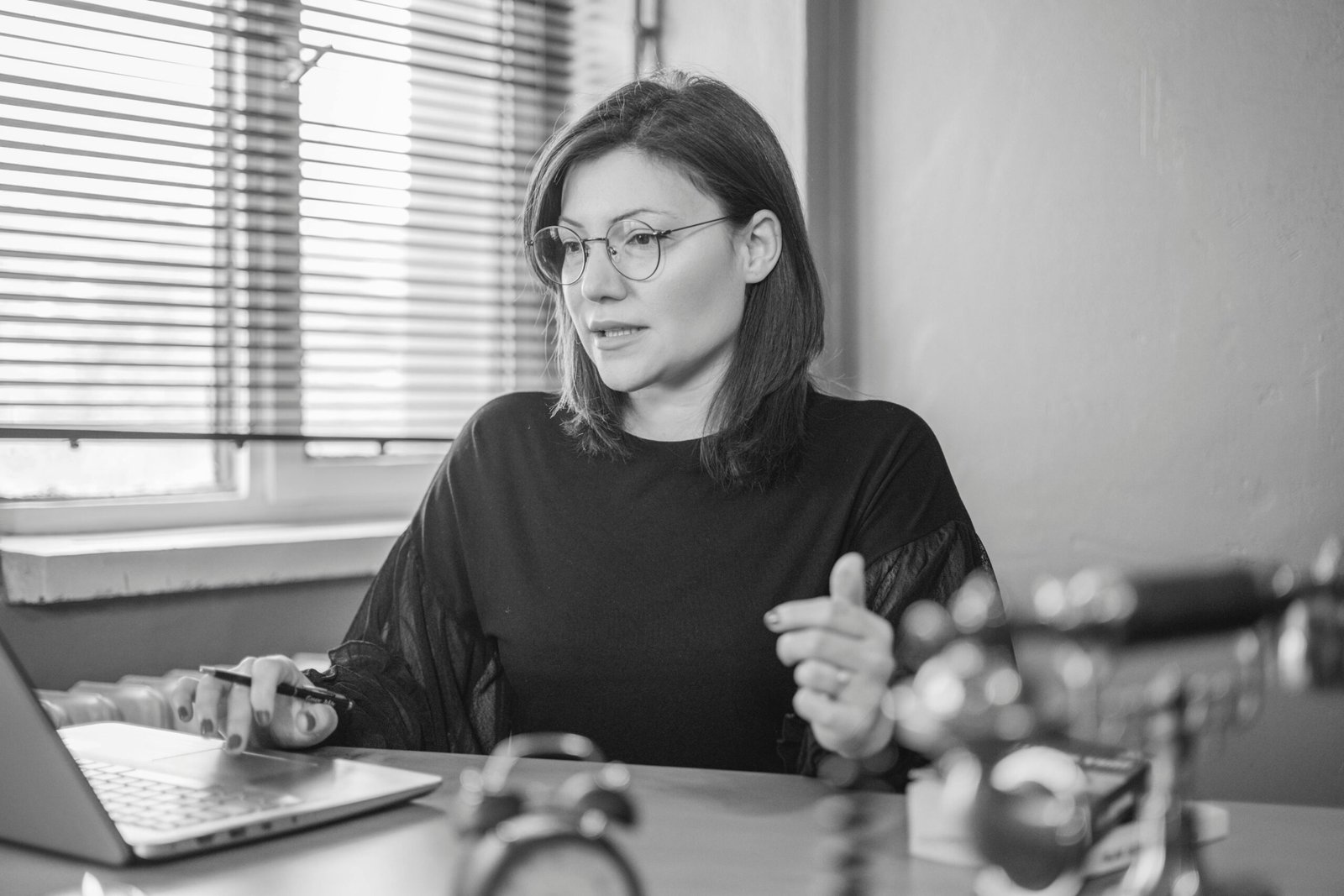 Why Professional Voice Over Services Build Trust With Your Audience 1 Business professional reviewing content on a computer while evaluating professional voice over services for audience engagement and brand trust