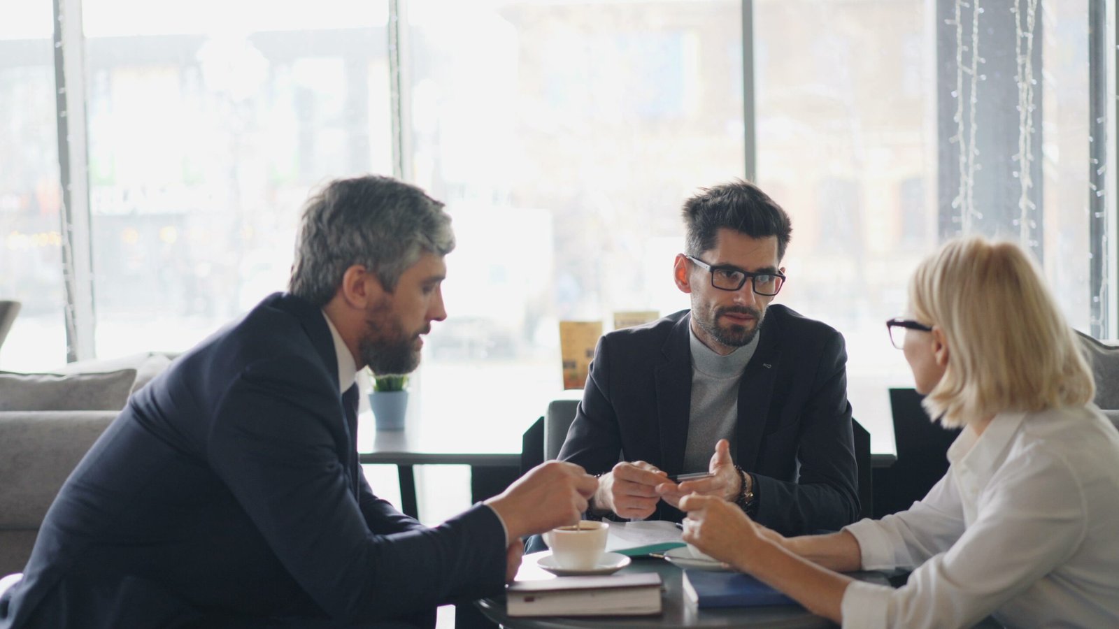 Why Professional Voice Over Services Build Trust With Your Audience 2 Three business professionals discussing brand messaging and communication strategy, illustrating how professional voice over services strengthen brand voice and audience trust