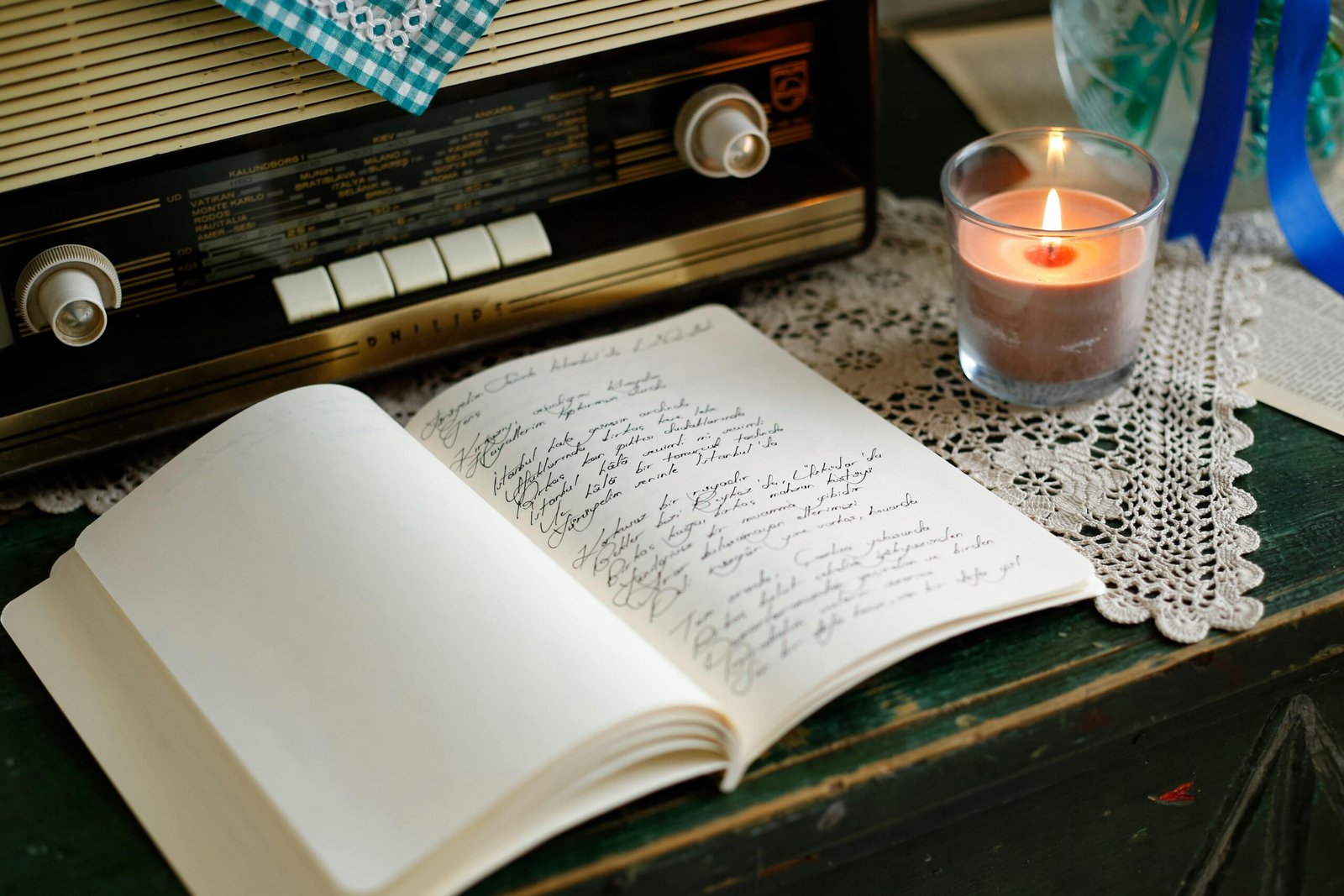 Acting blog journal with a vintage radio and candle for actor resources and creative inspiration