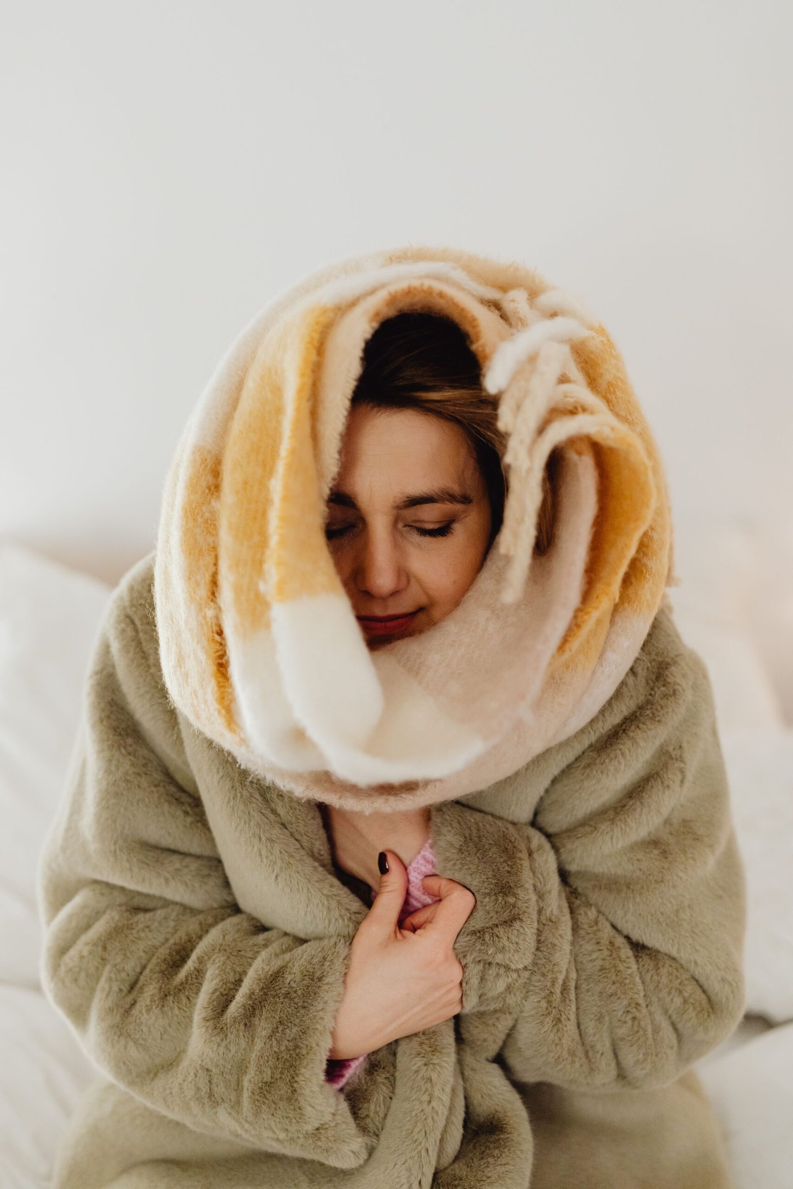 Underwater Film Production: What Producers Need to Know Before Production 4 Woman wrapped in a blanket warming up after an Underwater Film Production in cold-water conditions.