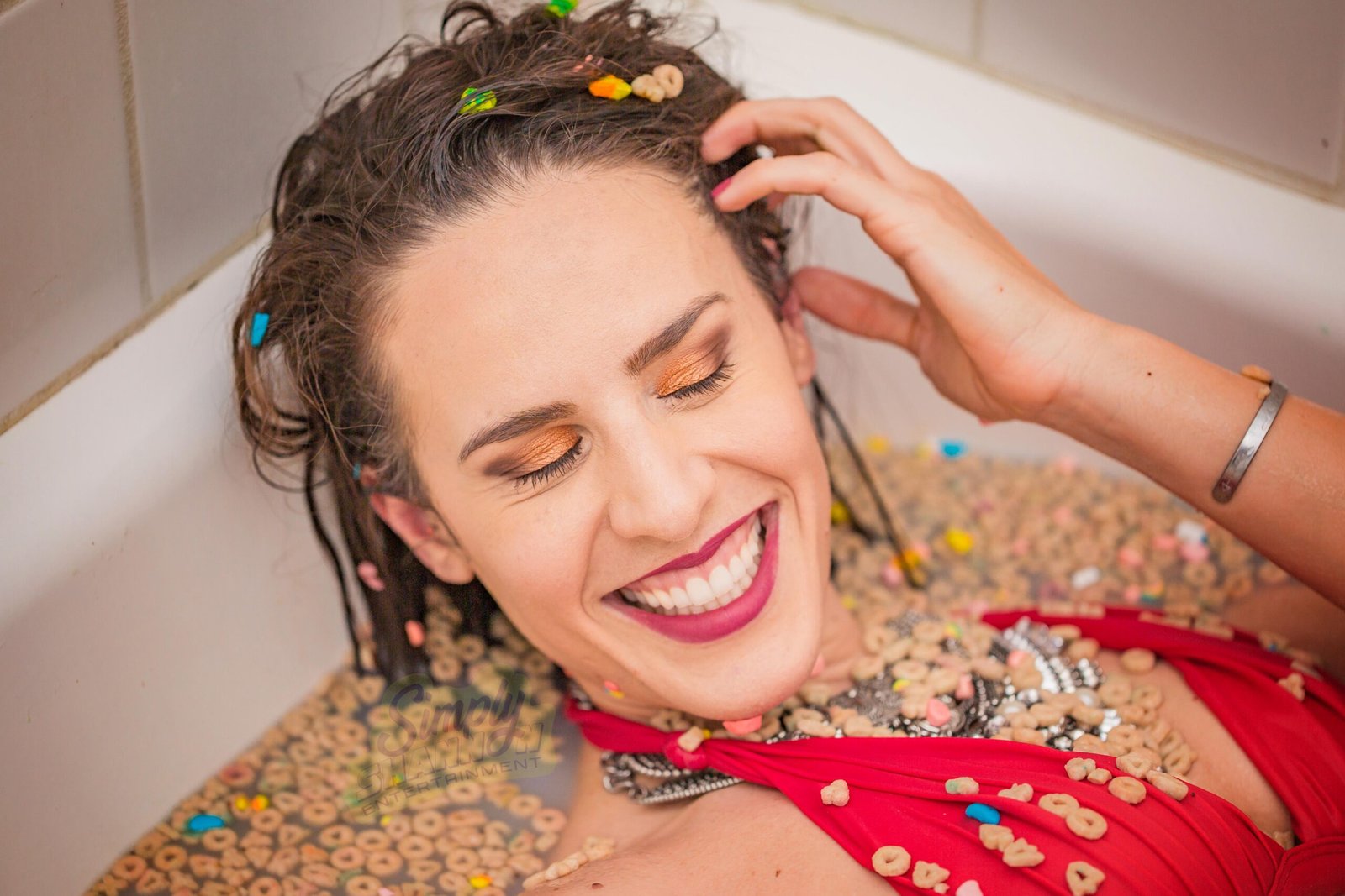 7 Ways to Handle Rejection in Acting and Keep Moving Forward 4 Shannon Scott smiling in a bathtub filled with Cheerios
